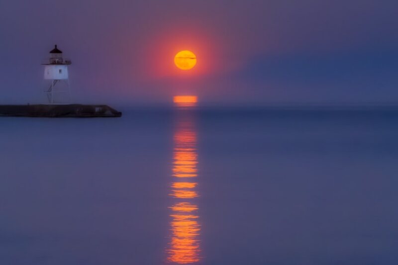 Image of a lighthouse at sunset.